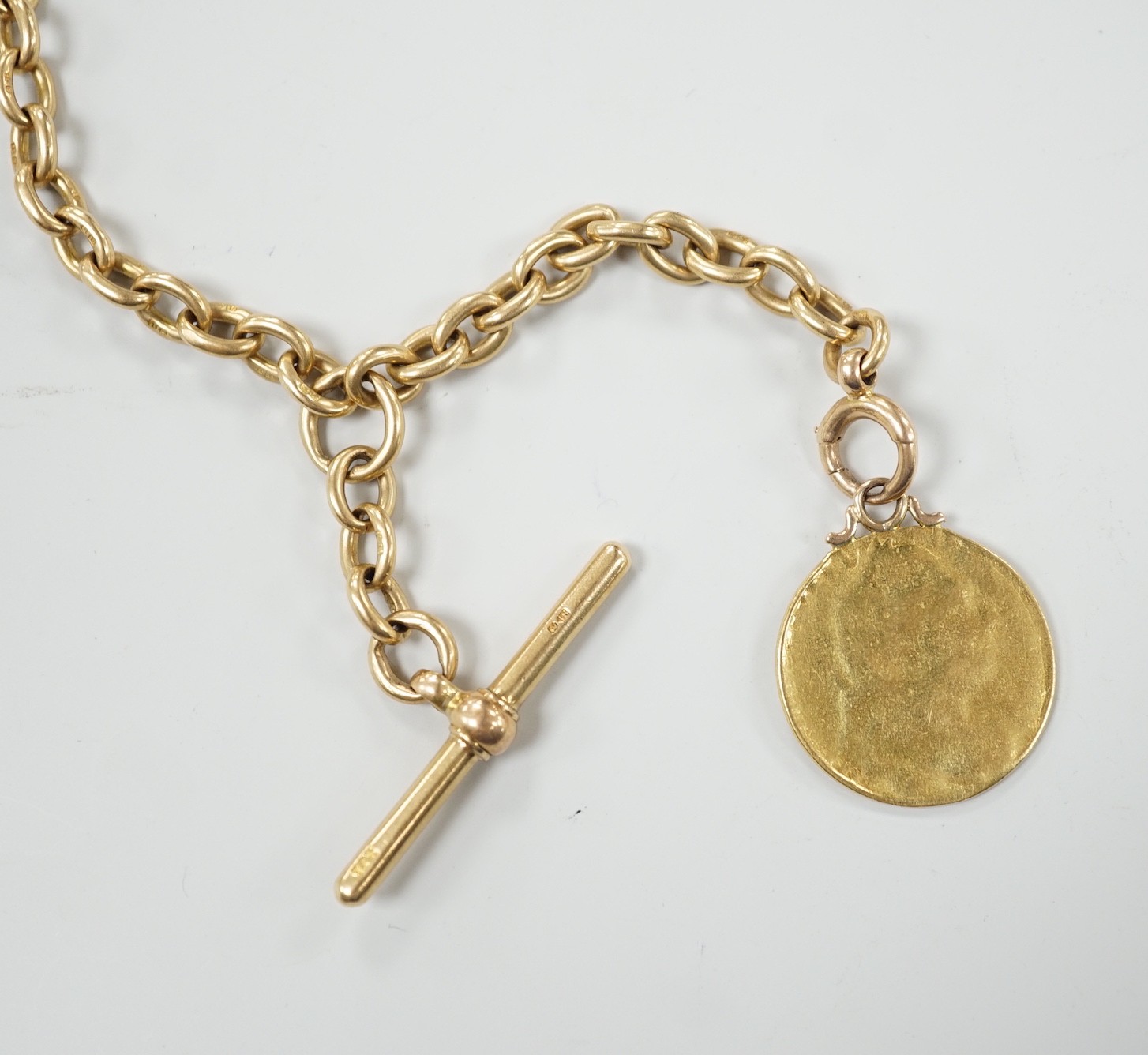 An early 20th century 18ct gold albert, 44cm, hung with a gold coin (worn), chain 53 grams, coin and bale, 9 grams.